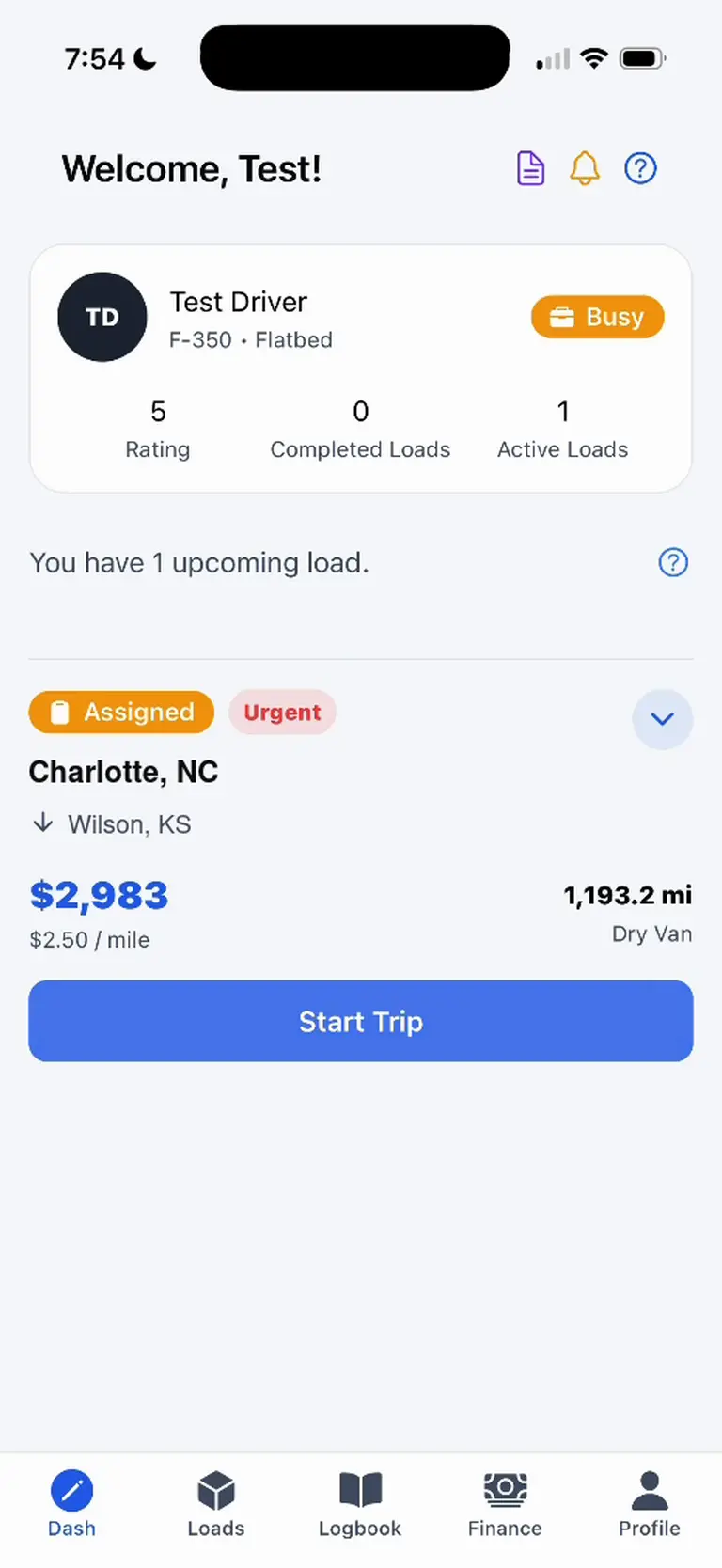 Driver dashboard with availability, an assigned load, city and state locations, trip earnings, mileage, and a Start Trip button.